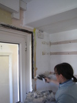SX22351 Jenni plastering kitchen.jpg